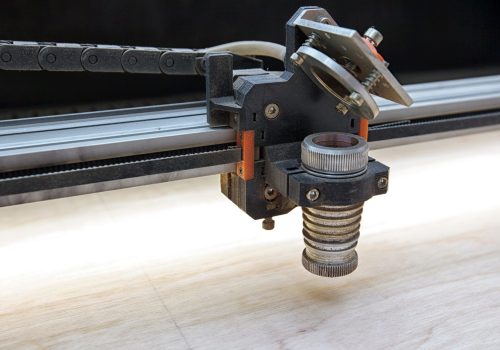 Laser,Cutting,Machine,Is,Cutting,The,Wooden,Plank